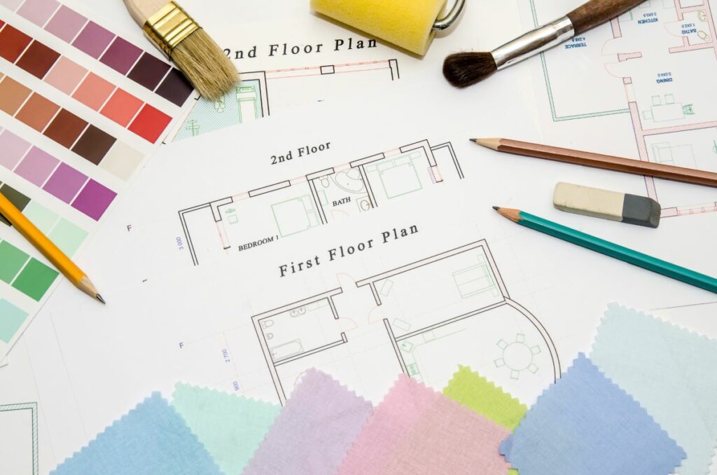 Architectural drawing with paintbrush, color sample and working tools - CK Contracting, - Home Renovations -Mount Pleasant, SC